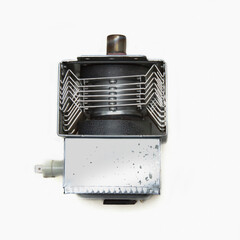 Magnetron from a microwave oven isolated on a white background