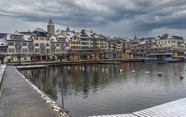 First day of advent with snow over the harbor of the old city of Rapperswil (Rappi), St. Gallen, Switzerland