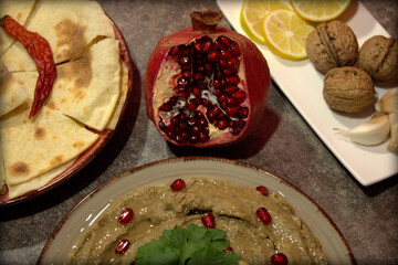 Baba ganoush . Arabian appetizer roasted eggplant dip served with Pita chips . Selective focus.