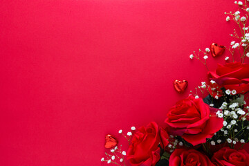 Valentine's day mock up with gypsophila, red ribbon and hearts isolated on red background. Copy space.