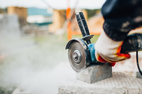 Dust From Cutting Concrete Stone With An Electric Grinder - Diamond Blade For Fast And Accurate Sawing - Construction Site