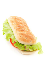 White bread sandwich with lettuce, ham, cucumber and tomatoes. Studio photo isolated on white background. 