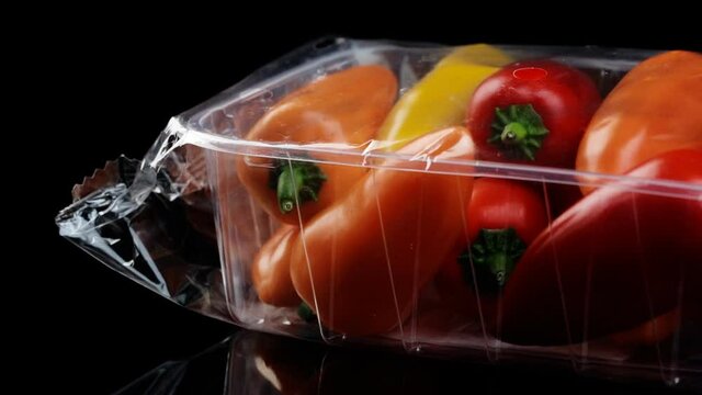 Packed in a zip lock, fresh Bulgarian sweet pepper, rotates slowly, presenting its taste and brilliance.