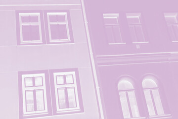 Light pink violet facade of houses. Fragment, details