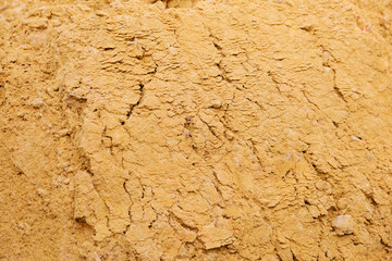 River sand, flat surface of yellow quartz wet sand in a quarry.