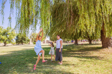 Family have fun on beautiful summer day in the park