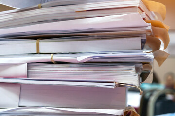 Overload stack messy documents of report papers for reseacrch teacher classroom planing on desk...