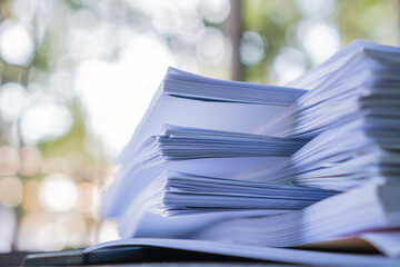Business paper in offices working for arranging documents unfinished stack of document papers with...