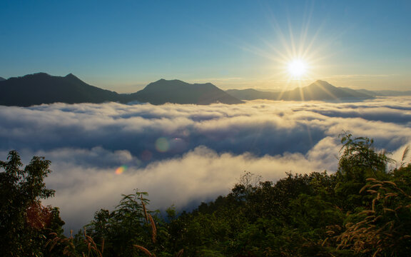 beautiful sunrise over mountain with fog in the morning	