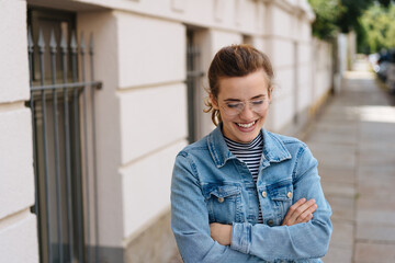 Happy young woman chuckling to herself