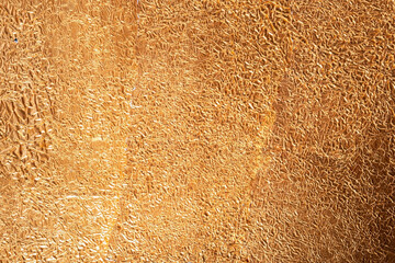 crumpled golden copper foil texture, top view, close up