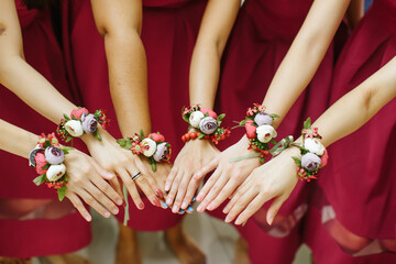 View of bridesmaid with little flower bouquets