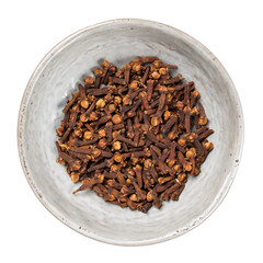 Spice cloves in gray ceramic bowl isolated on white. Top view.