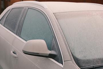 Close-Up Of Frozen Car windows During Winter season. Frost layer