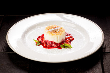 cheesecake garnished with strawberry jam