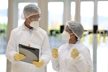 Medical people with protective equipment checking medical file