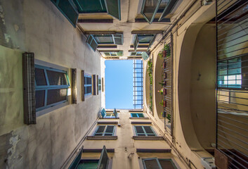 Fototapeta premium Naples, Italy - one of the main highlights in Naples are the wonderful court yards which can be found all around the Old Town. Here in the picture one the many examples 