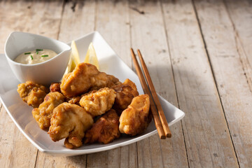 Spicy chicken karaage on wooden table