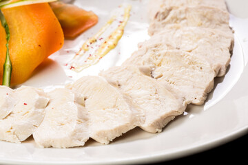 chicken fillet with vegetables on a white plate