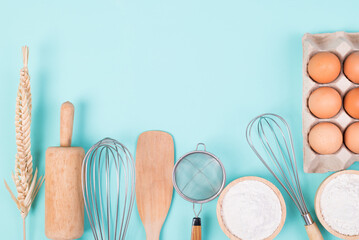 Kitchen utensils and food ingredients for bakery cooking on color background, Top view