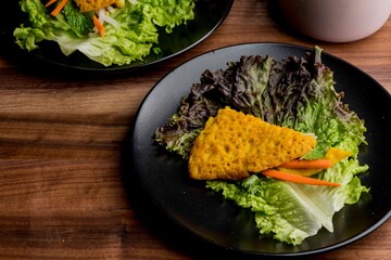 Omelette made with bacon, ham, sausage, bell peppers, heirloom tomatoes, spinach, onions, cheddar & Swiss cheese. Served with crispy potato hash, a classic American breakfast or brunch favorite.