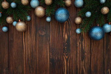 Christmas composition. Christmas balls, blue and silver decorations on blue wooden background. Flat lay. Top view. Copy space