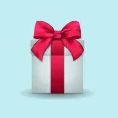 Present box with red ribbon and bow