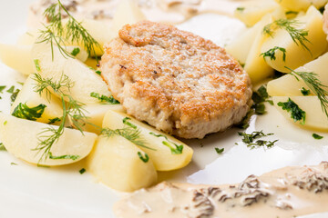 chicken cutlet with potato wedges ready-made dish for the menu
