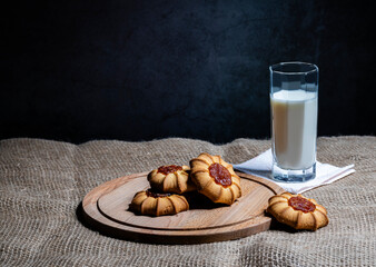 Kurabye cookies with filling and a glass of milk.