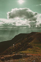 Autumn colors in beautiful mountain areas. Forest, old village and road through the autumn story