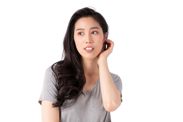 Portrait of a smiling Asian business woman looking at camera isolated over white background. Happy Young Asian Woman with blank copy space. Beauty emotion facial expression. 