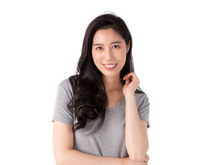 Portrait of a smiling Asian business woman looking at camera isolated over white background. Happy Young Asian Woman with blank copy space. Beauty emotion facial expression. 