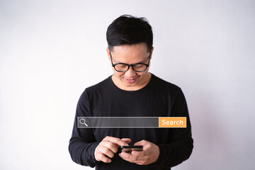 Asian men use smartphones to find what they are interested in. Searching information data on internet networking concept