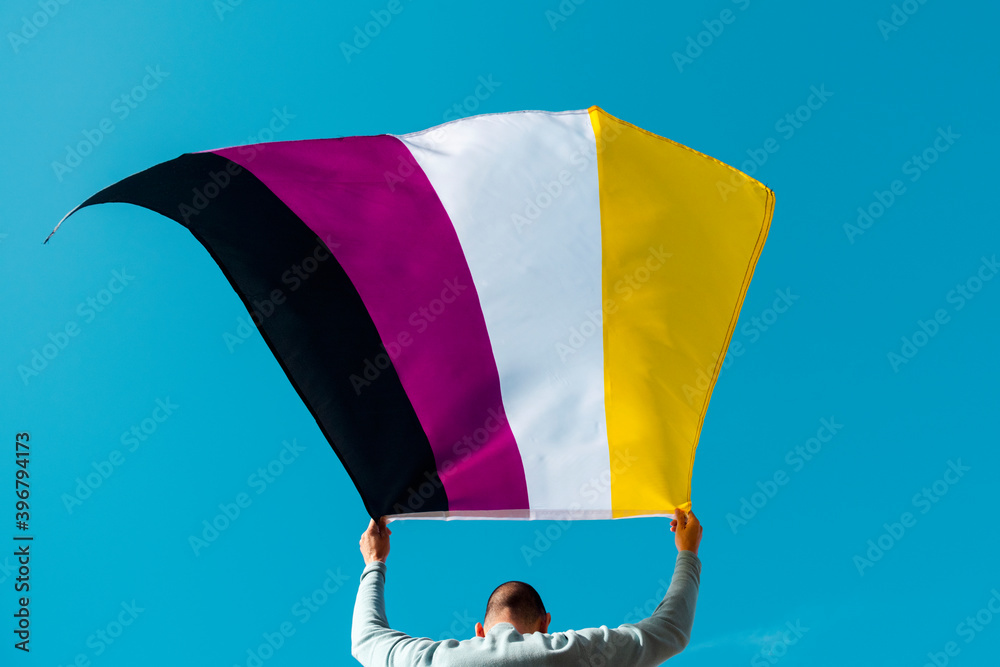 Sticker person waving a non-binary pride flag