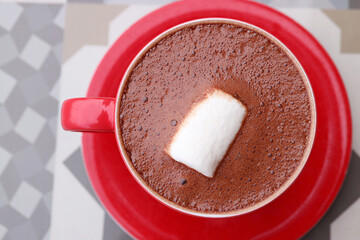 Top View of a Cup of Hot Chocolate with a Floating White Marshmallow