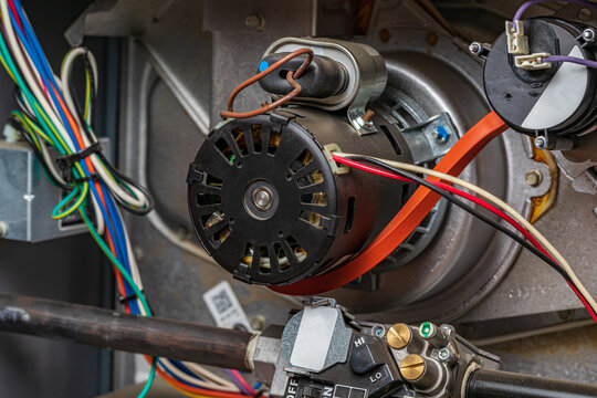 Closeup Of Heater Exhaust Fan Inside Of Furnace. Concept Of HVAC Maintenance, Repair, Service And Installation