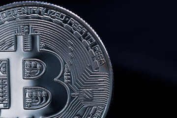 Metallic bitcoin with imperfections in macro view with negative space for copy