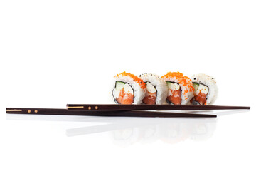 Four fresh sushi bites and chopsticks. Studio photo isolated on white background on reflective surface. Bright light setting. © Stockis