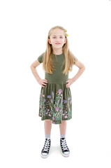 Full length image of a pretty little girl, posing. Isolated on white background 
