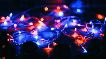 festive background.colored lights on a black background