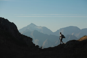 Fototapeta premium man with hiking poles in the mountains