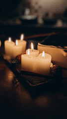 White candles on a wooden table