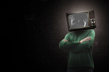 Fear. Male body of model with old-fashioned TV set instead head isolated on black background. Trendy colours and modern design. Contemporary art collage. Inspiration, mood, creativity, brain concept