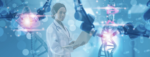 Fototapeta premium Soft focus-doctor use computer laptop control robotic arm,review and find talent from DNA,concept futuristic smart healthcare heredity,robot arm medical technology,control by artificial intelligence