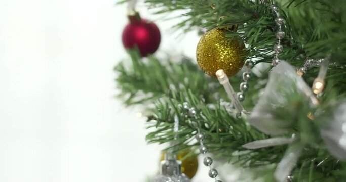 Christmas decorations on spruce branches.