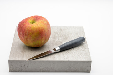 red apple and chopping knife