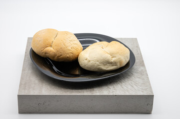 two fresh rolls on a plate