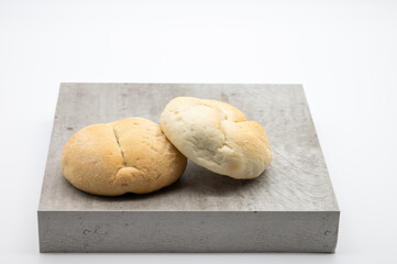 two fresh rolls on a plate