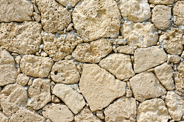Texture of an old stone wall. Well seen pattern.