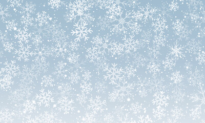 Snow background. Winter snowfall. White snowflakes on blue sky. Christmas background. Falling snow.